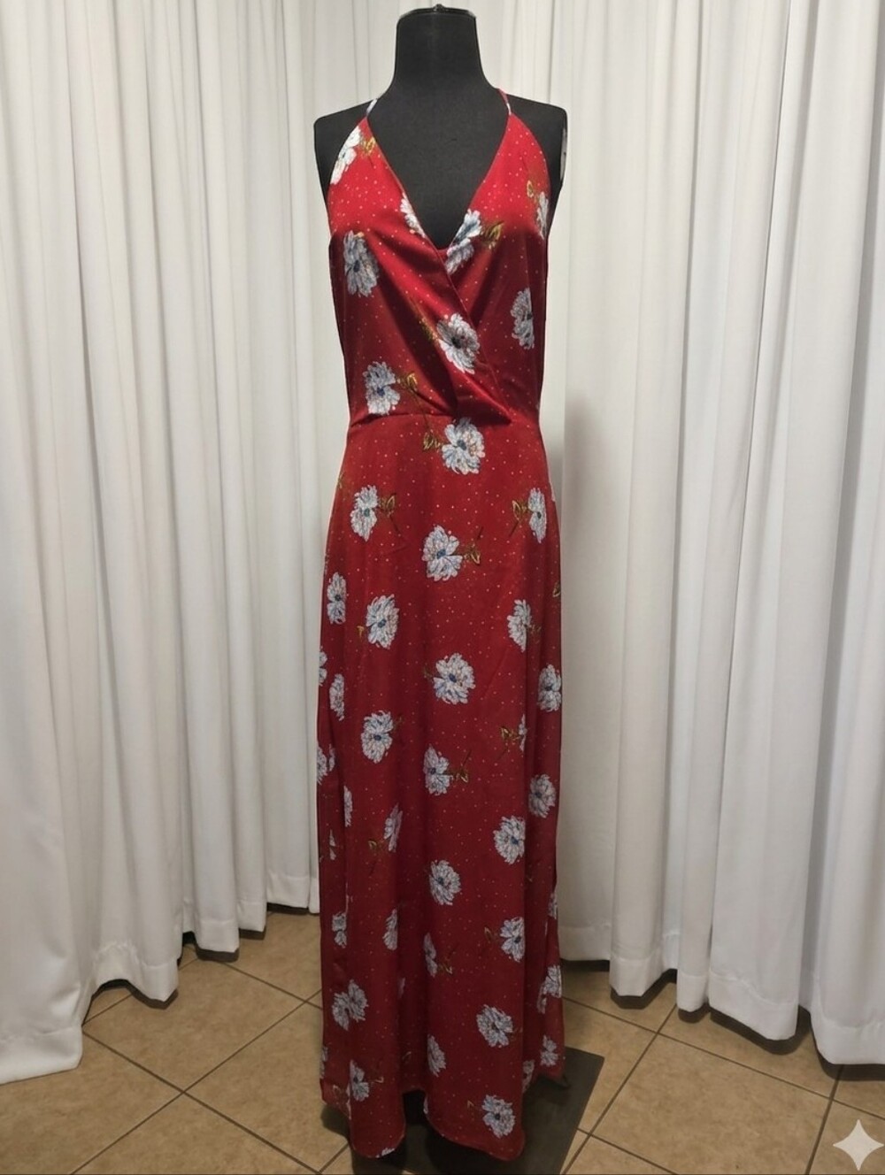 Lush red floral maxi dress featuring a V-neckline and a side slit.